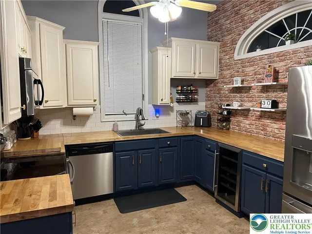 a bathroom with a double vanity sink mirror and toilet