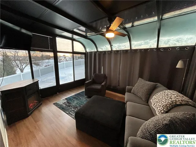 a bedroom with a bed and a desk