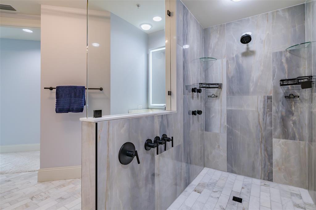 130 Riviera Dunes Way, Unit 802 Palmetto, FL 34221 - Photo 17 of 56 a bathroom with a shower