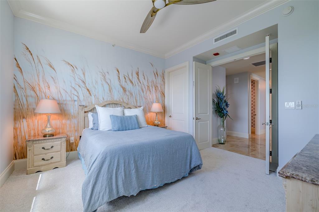 130 Riviera Dunes Way, Unit 802 Palmetto, FL 34221 - Photo 20 of 56 a bedroom with a bed and a cabinets