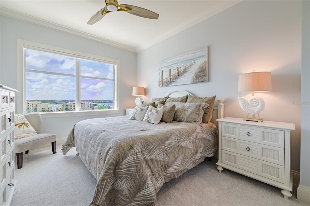 130 Riviera Dunes Way, Unit 802 Palmetto, FL 34221 - Photo 23 of 56 a bed room with a bed and a couch