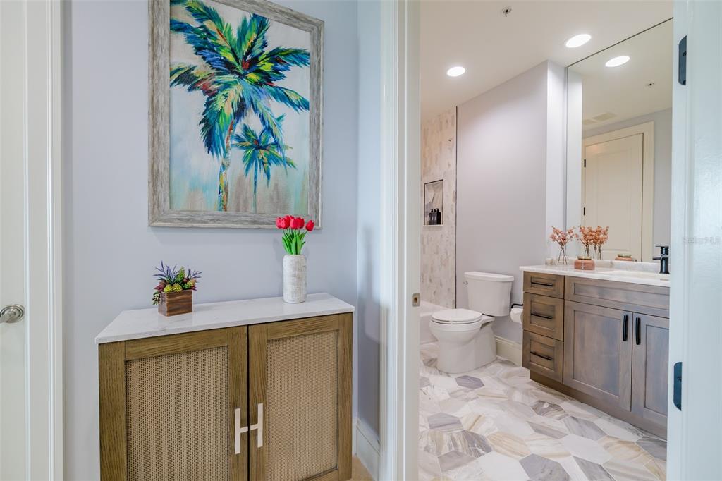 130 Riviera Dunes Way, Unit 802 Palmetto, FL 34221 - Photo 25 of 56 a bathroom with a sink a toilet and a mirror