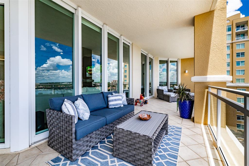 130 Riviera Dunes Way, Unit 802 Palmetto, FL 34221 - Photo 27 of 56 a living room with furniture fireplace and large window