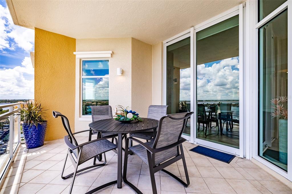130 Riviera Dunes Way, Unit 802 Palmetto, FL 34221 - Photo 28 of 56 a view of a dining room with furniture and front door