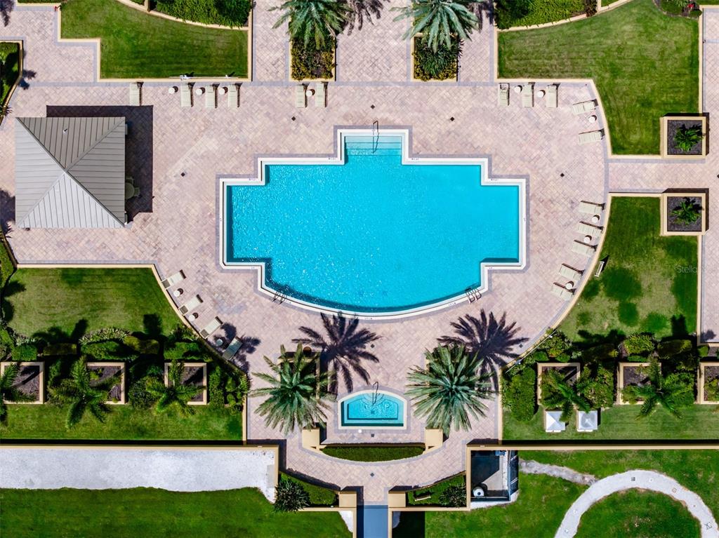 130 Riviera Dunes Way, Unit 802 Palmetto, FL 34221 - Photo 32 of 56 an aerial view of a house with a garden and swimming pool