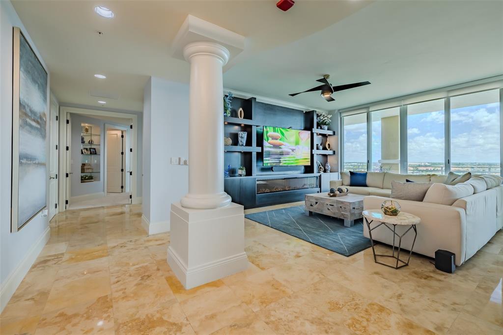 130 Riviera Dunes Way, Unit 802 Palmetto, FL 34221 - Photo 4 of 56 a living room with furniture and a large window
