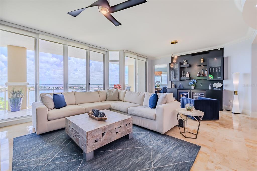130 Riviera Dunes Way, Unit 802 Palmetto, FL 34221 - Photo 5 of 56 a living room with furniture and a large window