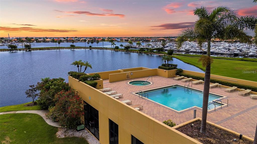 130 Riviera Dunes Way, Unit 802 Palmetto, FL 34221 - Photo 56 of 56 a view of a swimming pool with a terrace