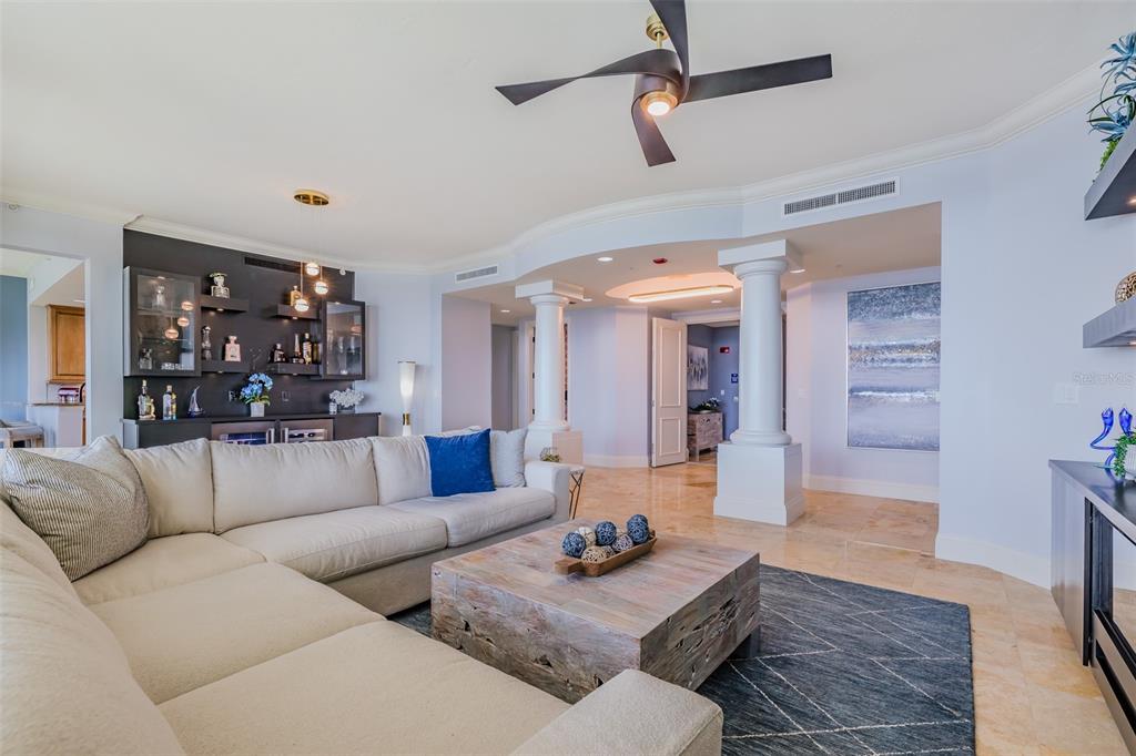 130 Riviera Dunes Way, Unit 802 Palmetto, FL 34221 - Photo 8 of 56 a living room with furniture and wooden floor