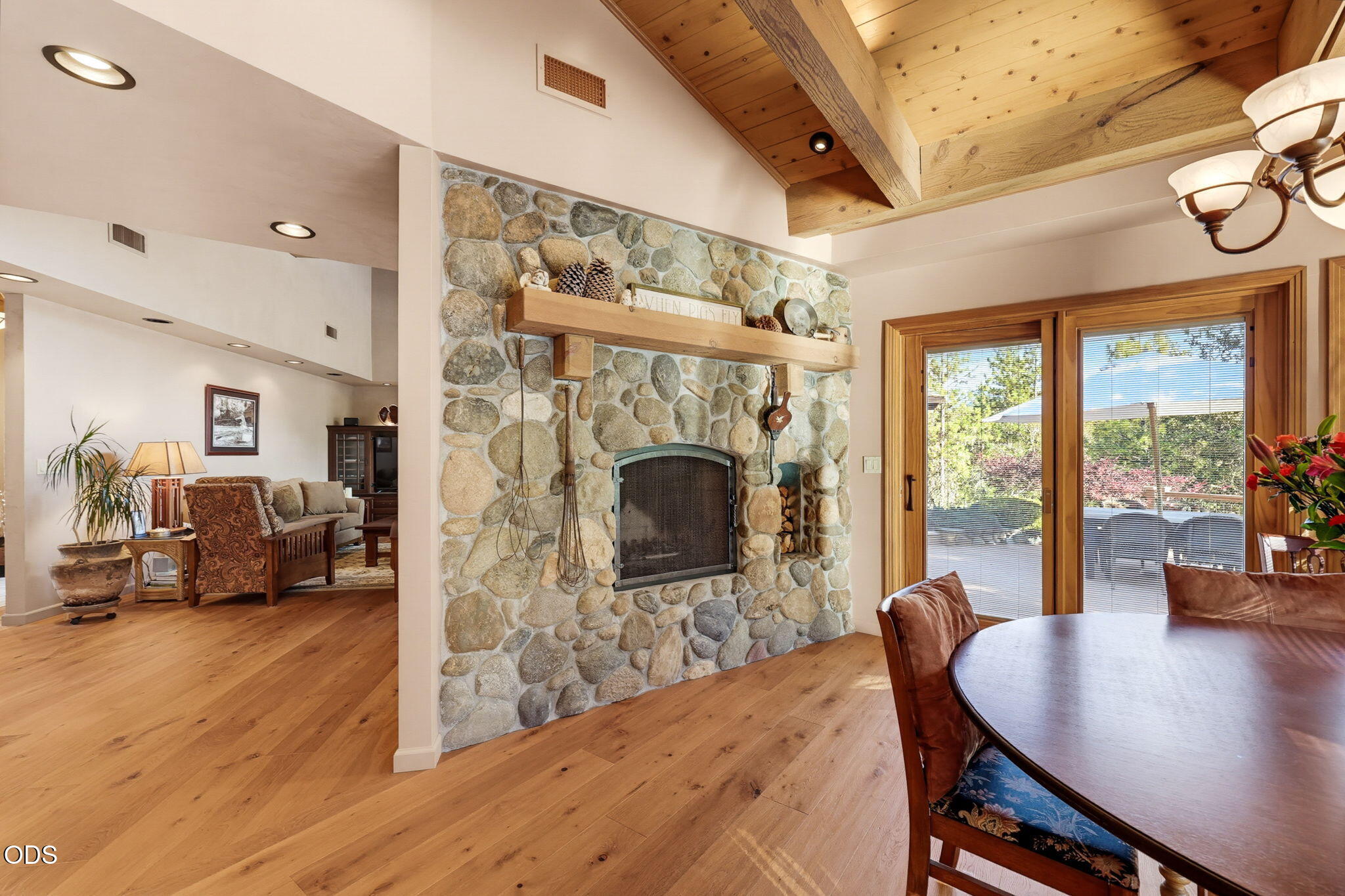 2459 Little Applegate Road Jacksonville, OR 97530 - Photo 16 of 86 a living room with furniture a fireplace and a floor to ceiling window