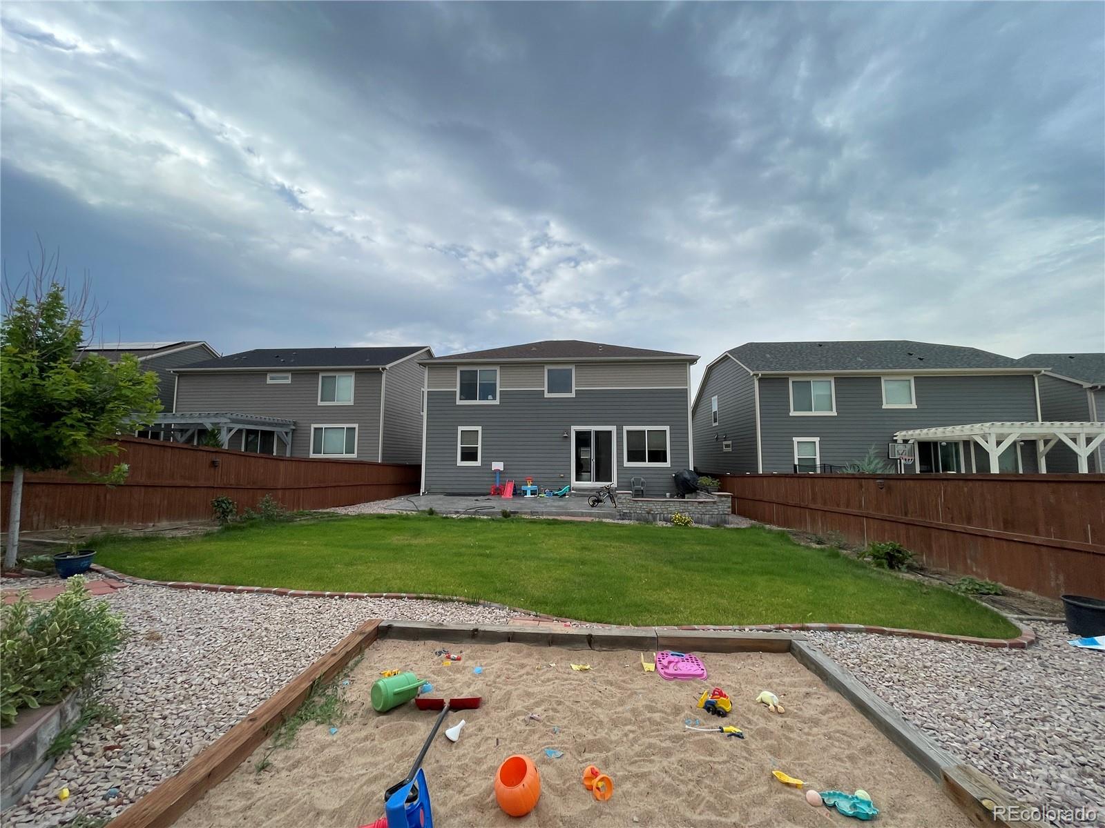 17342 Springfield Drive Parker, CO 80134 - Photo 31 of 35 a front view of a house with a garden