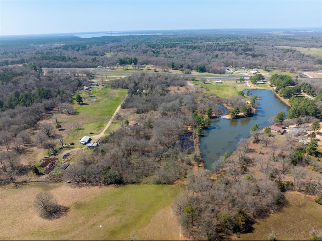0 Us 271 Arthur City, TX 75411 - Photo 11 of 24 an aerial view of residential houses with outdoor space