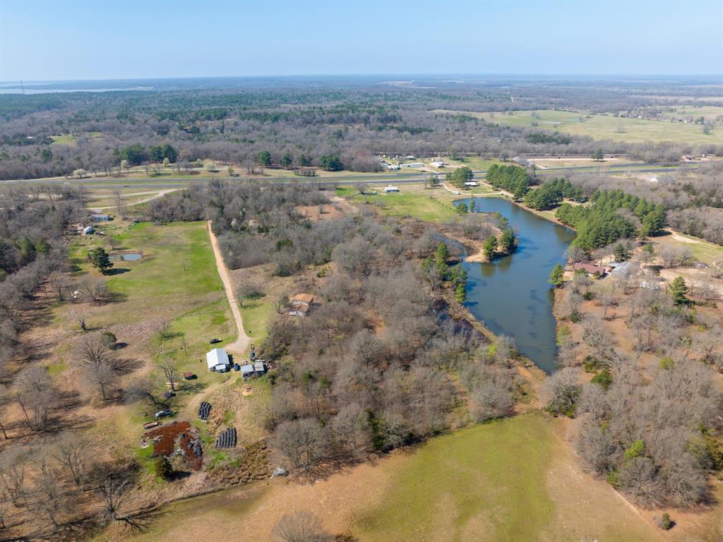 0 Us 271 Arthur City, TX 75411 - Photo 12 of 24 an aerial view of residential houses with outdoor space