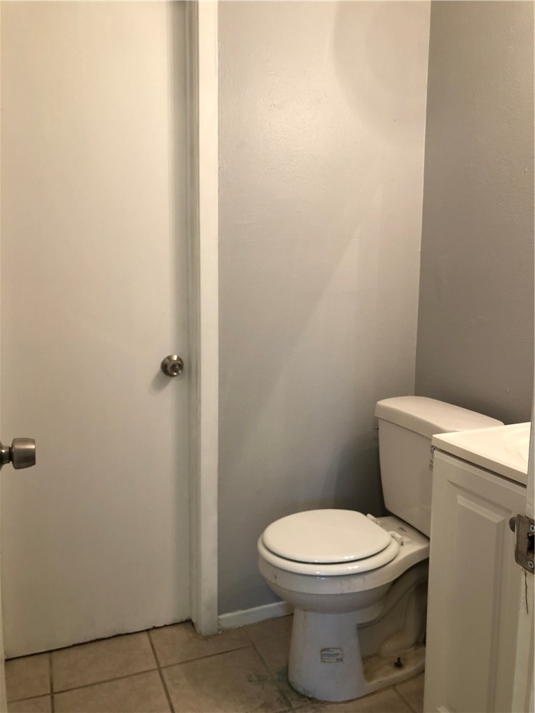 6502 South 1st Street, Unit 102 Austin, TX 78745 - Photo 17 of 26 a white toilet sitting next to a shower