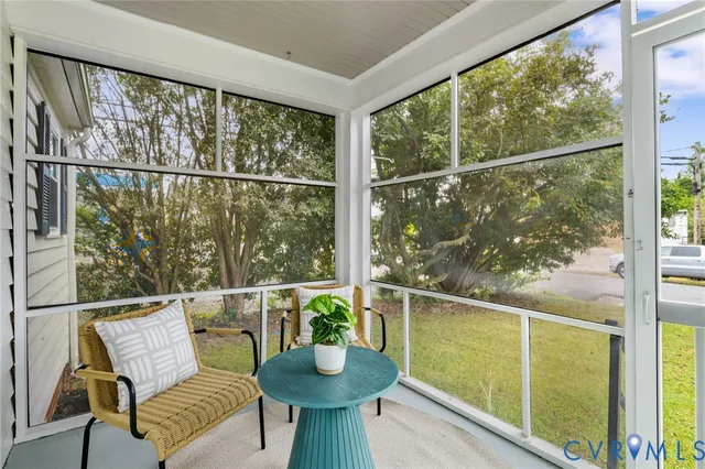 a view of a chair and table in the balcony