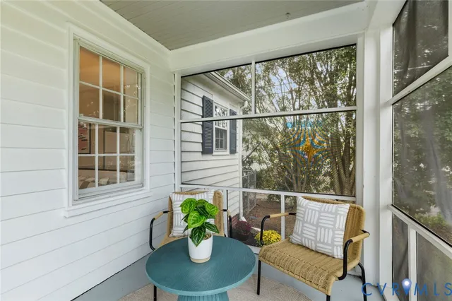 a view of a chair and table in the balcony