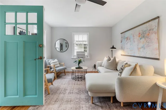 a living room with furniture and a window
