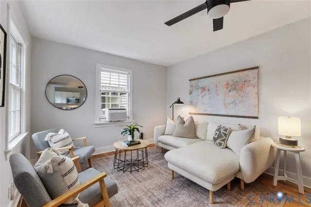 a bedroom with bed and a painting on the wall