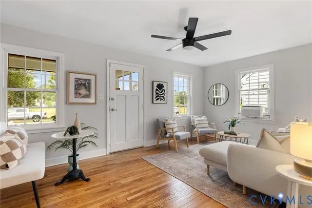 a living room with furniture or window and a wooden floor