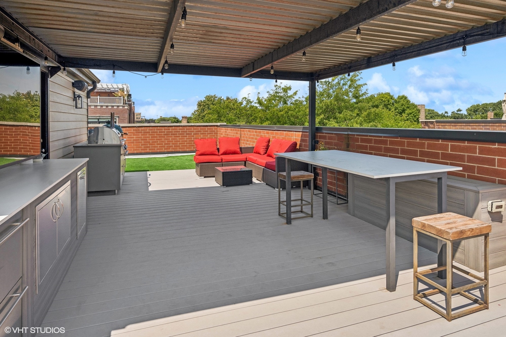 2449 North Racine Avenue, Unit 3 Chicago, IL 60614 - Photo 15 of 18 a view of a chairs and table in patio with a wooden fence