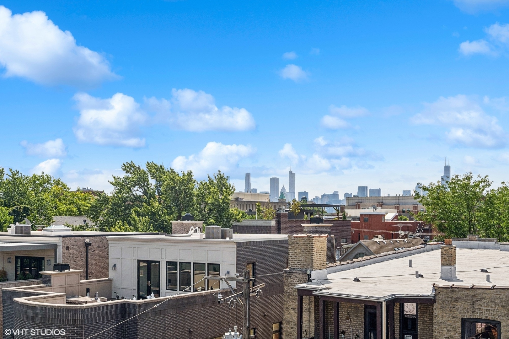 2449 North Racine Avenue, Unit 3 Chicago, IL 60614 - Photo 17 of 18 a view of a city that has tall buildings