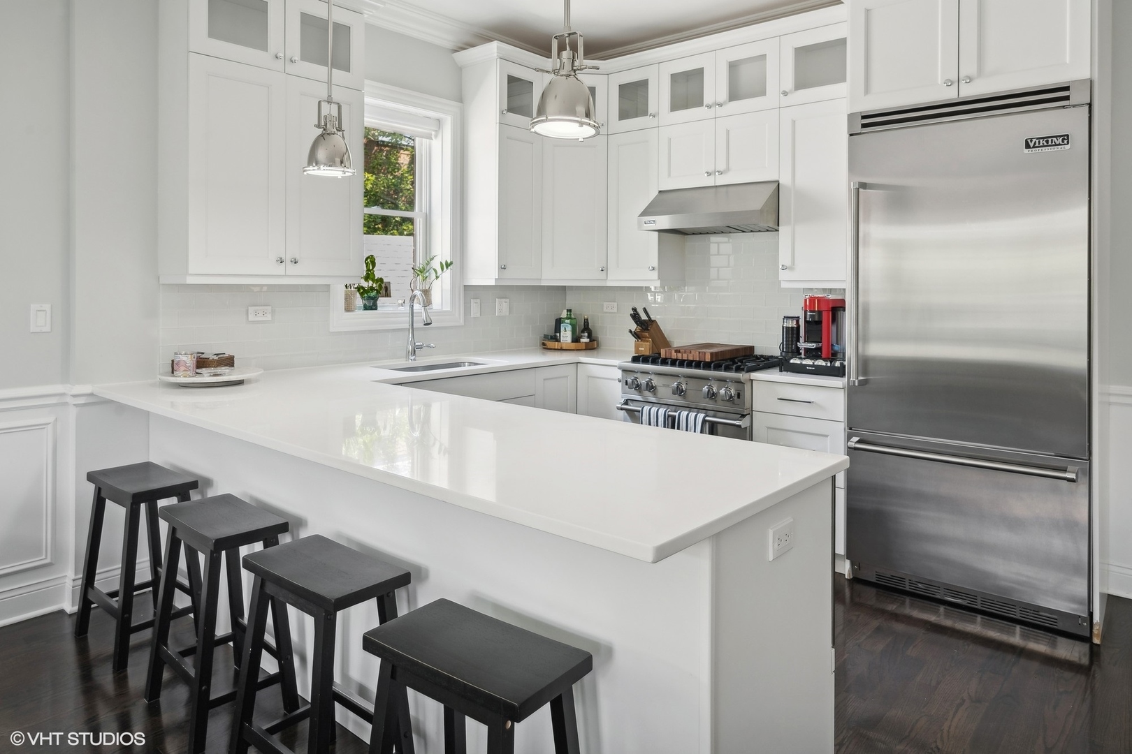 2449 North Racine Avenue, Unit 3 Chicago, IL 60614 - Photo 7 of 18 a kitchen with stainless steel appliances a sink a stove and a refrigerator