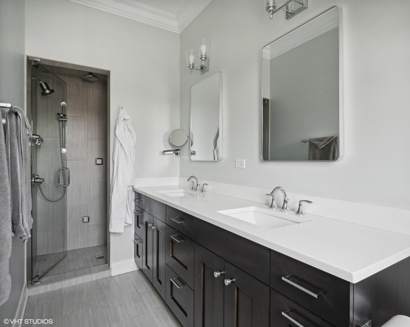 2449 North Racine Avenue, Unit 3 Chicago, IL 60614 - Photo 9 of 18 a bathroom with a double vanity sink mirror and shower