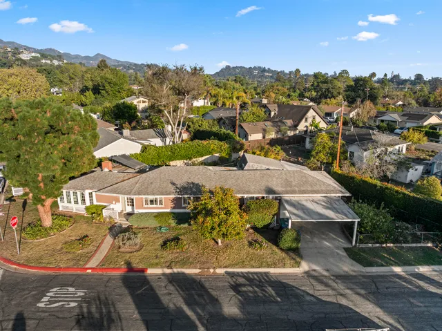 an aerial view of residential houses with outdoor space