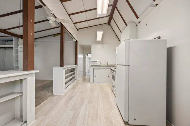 a view of a kitchen from the hallway