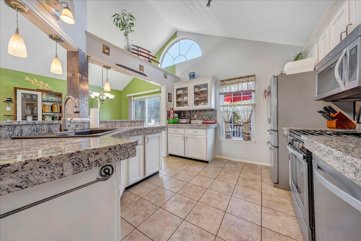 532 Ray Street Roanoke, VA 24019 - Photo 3 of 38 a kitchen with a stove a sink and a refrigerator