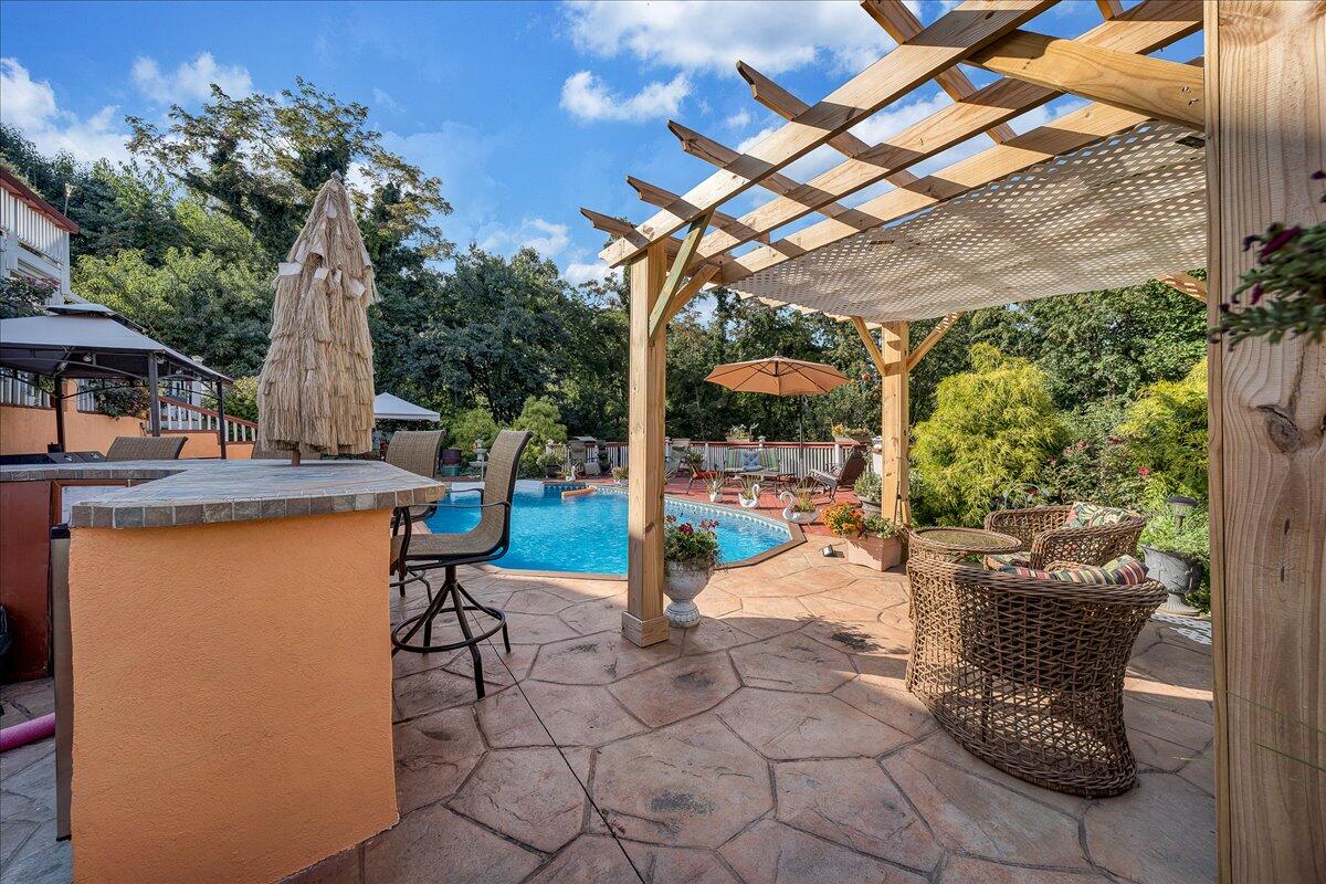 532 Ray Street Roanoke, VA 24019 - Photo 26 of 38 a view of a patio with a table and chairs and potted plants