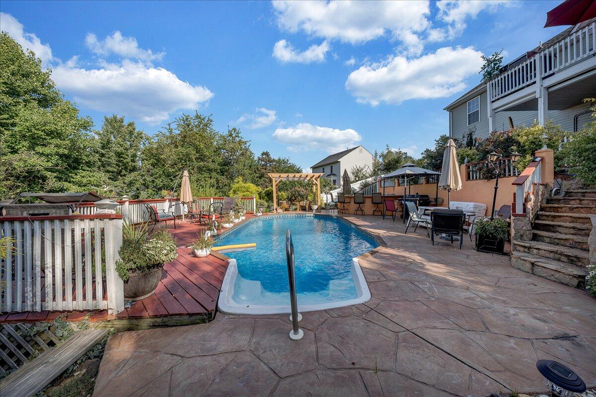 532 Ray Street Roanoke, VA 24019 - Photo 30 of 38 a view of a patio with couches and table and chairs and potted plants