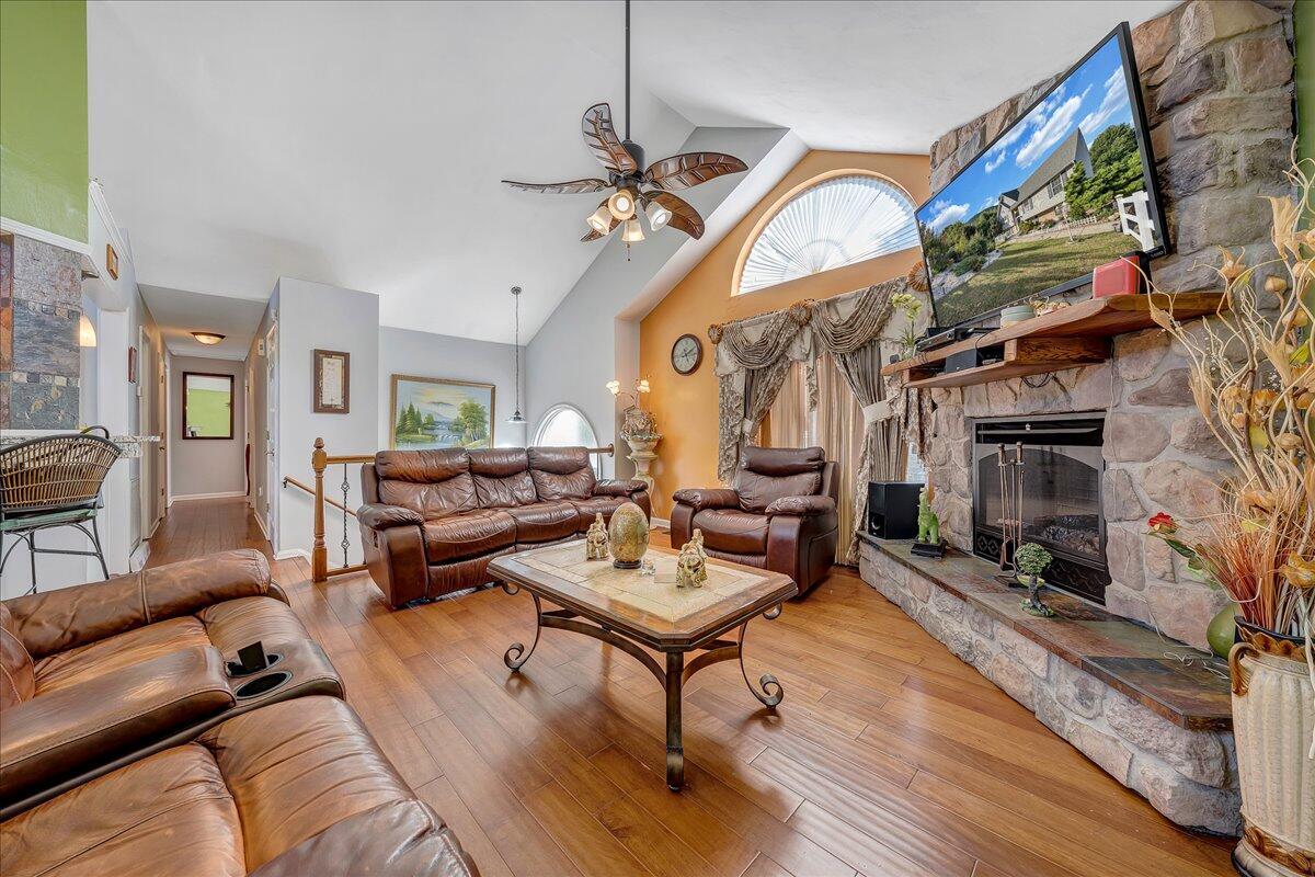 532 Ray Street Roanoke, VA 24019 - Photo 9 of 38 a living room with furniture a fireplace and a flat screen tv