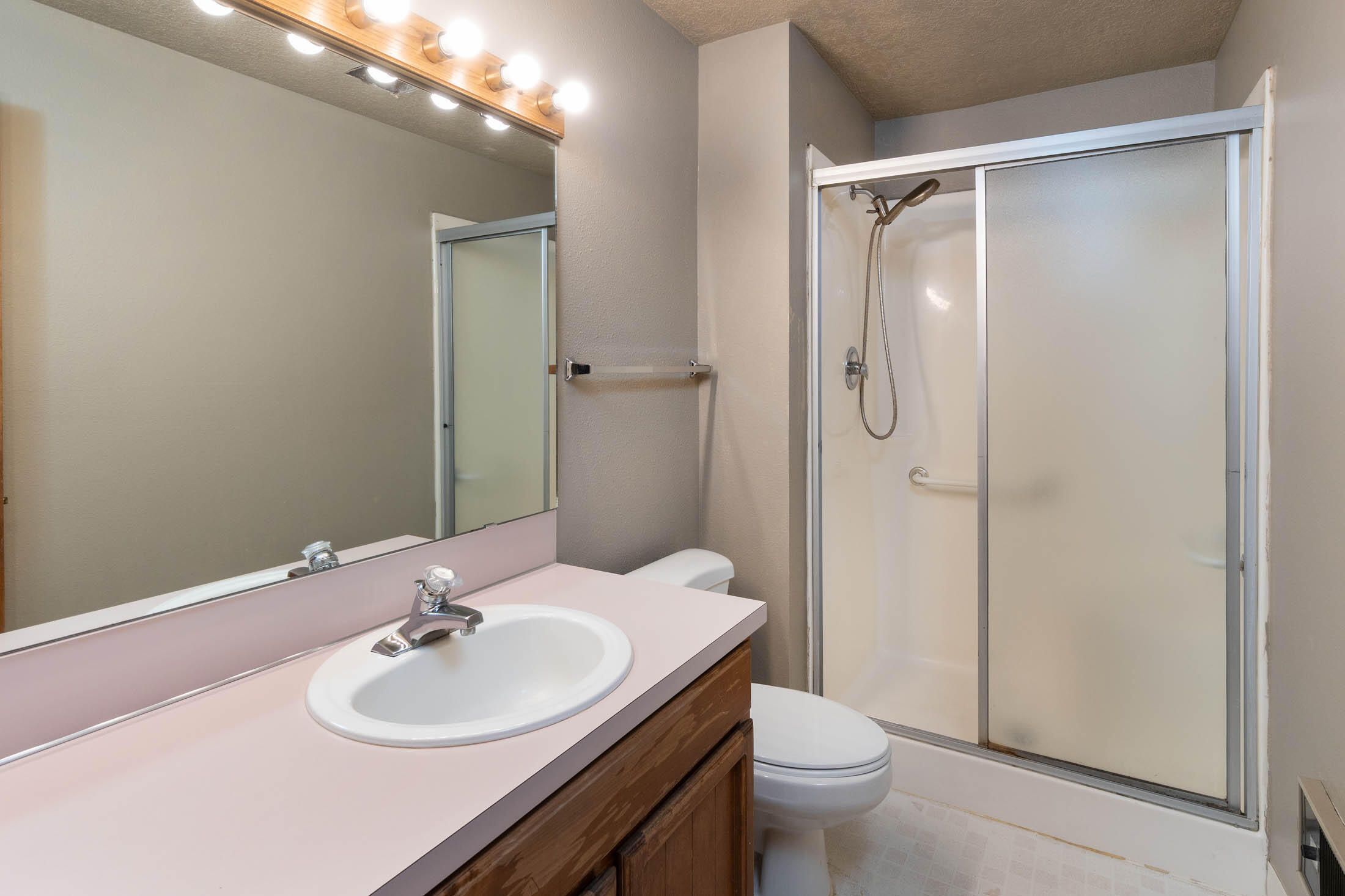 20316 Donkey Sled Road Bend, OR 97702 - Photo 18 of 50 a bathroom with a sink toilet mirror and shower