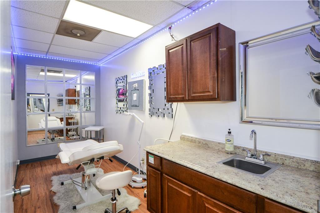 4298 Memorial Drive, Unit D Decatur, GA 30032 - Photo 12 of 26 a kitchen with a sink and cabinets