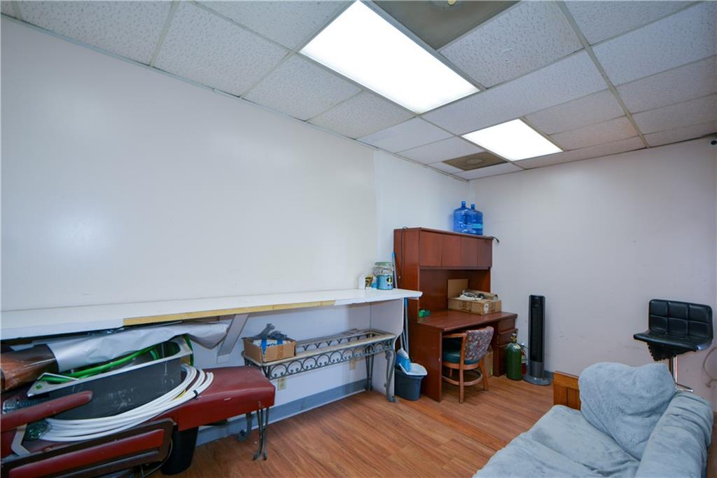 4298 Memorial Drive, Unit D Decatur, GA 30032 - Photo 15 of 26 a room with furniture and a wooden floor