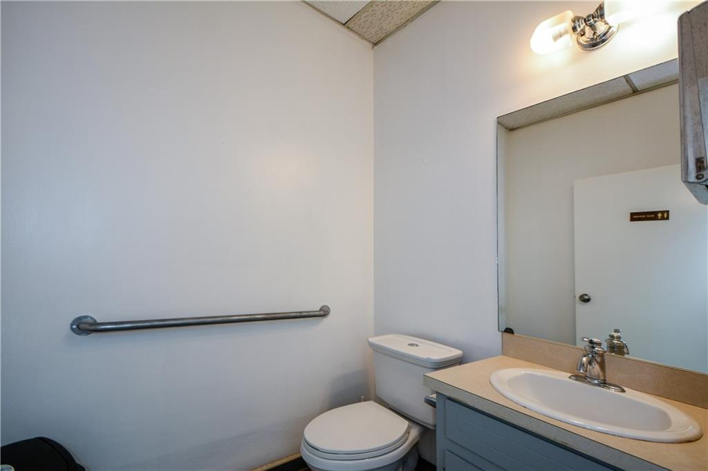 4298 Memorial Drive, Unit D Decatur, GA 30032 - Photo 19 of 26 a white toilet sitting next to a bathroom sink