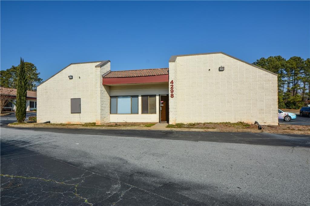 4298 Memorial Drive, Unit D Decatur, GA 30032 - Photo 26 of 26 a view of a white house with a street