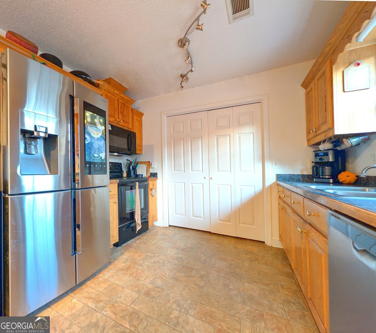 571 Suttles Road Martin, GA 30557 - Photo 3 of 6 a kitchen with stainless steel appliances a refrigerator and a sink