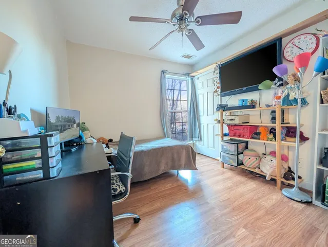 a room with furniture and a flat screen tv
