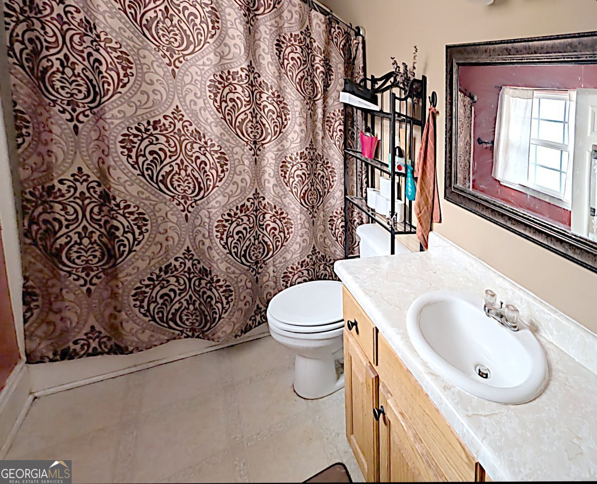571 Suttles Road Martin, GA 30557 - Photo 5 of 6 a bathroom with a toilet sink and mirror