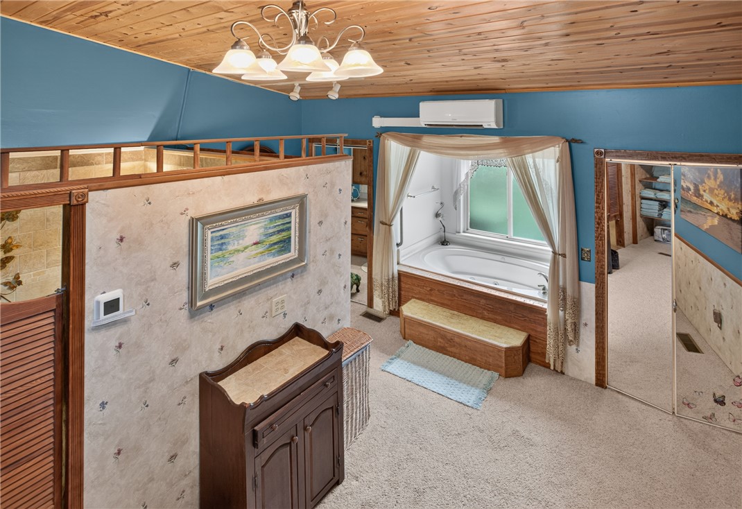 351 River Road Westminster, SC 29693 - Photo 24 of 50 Luxurious bath with a soaking tub and elegant wood ceiling detailing.