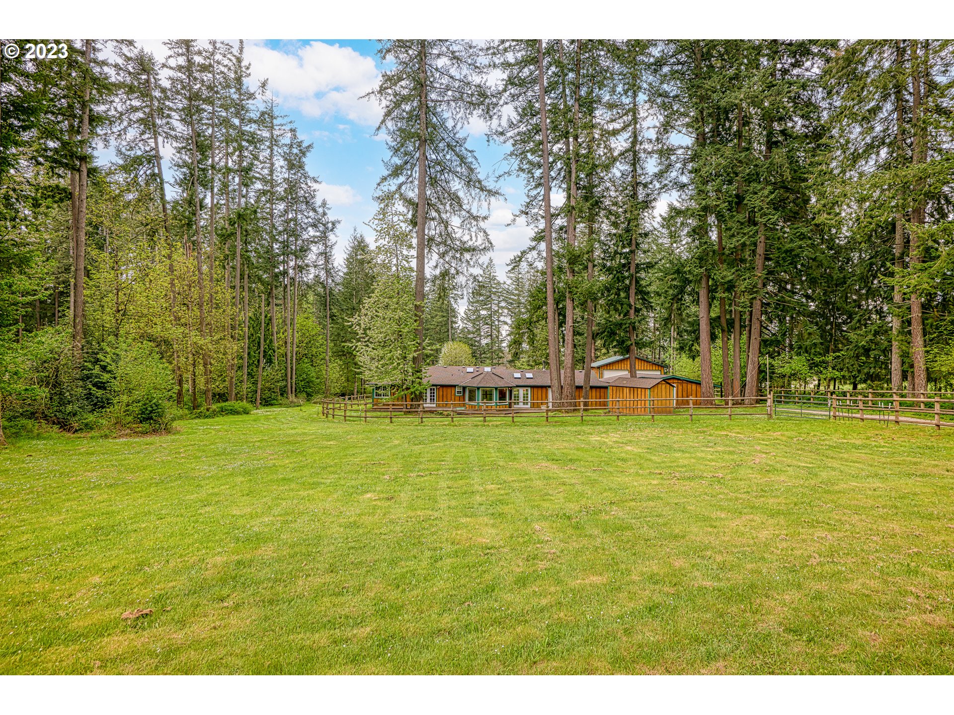23490 South Beatie Road Oregon City, OR 97045 - Photo 22 of 30 a swimming pool with trees in the background