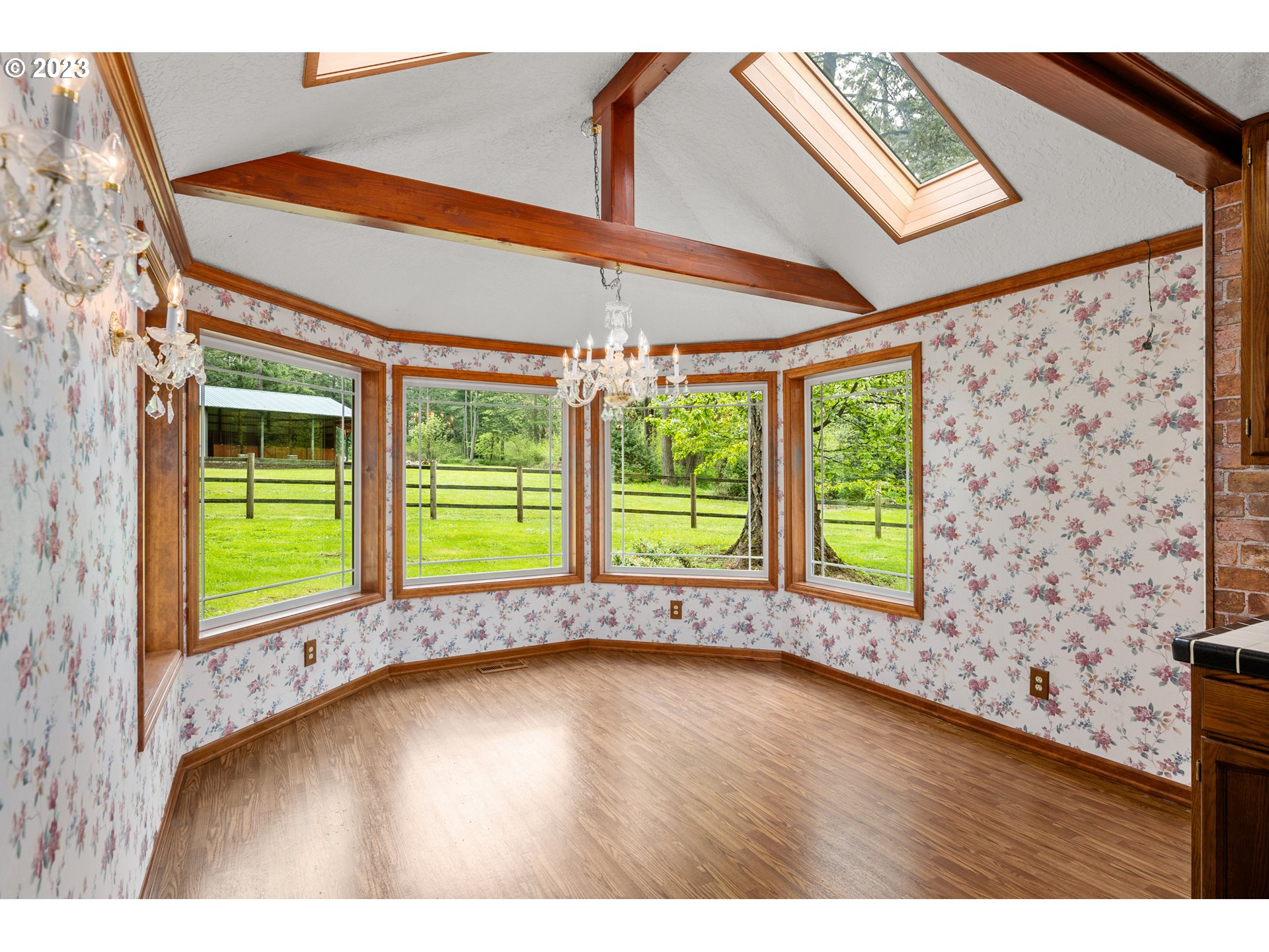 23490 South Beatie Road Oregon City, OR 97045 - Photo 9 of 30 a view of an empty room with a window and wooden floor