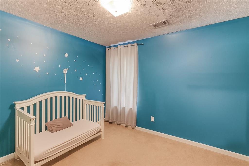 625 Springwood Trail Monroe, GA 30655 - Photo 11 of 23 a bedroom with a bed