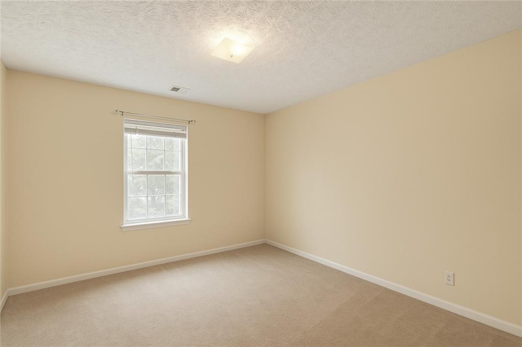 625 Springwood Trail Monroe, GA 30655 - Photo 13 of 23 an empty room with a window