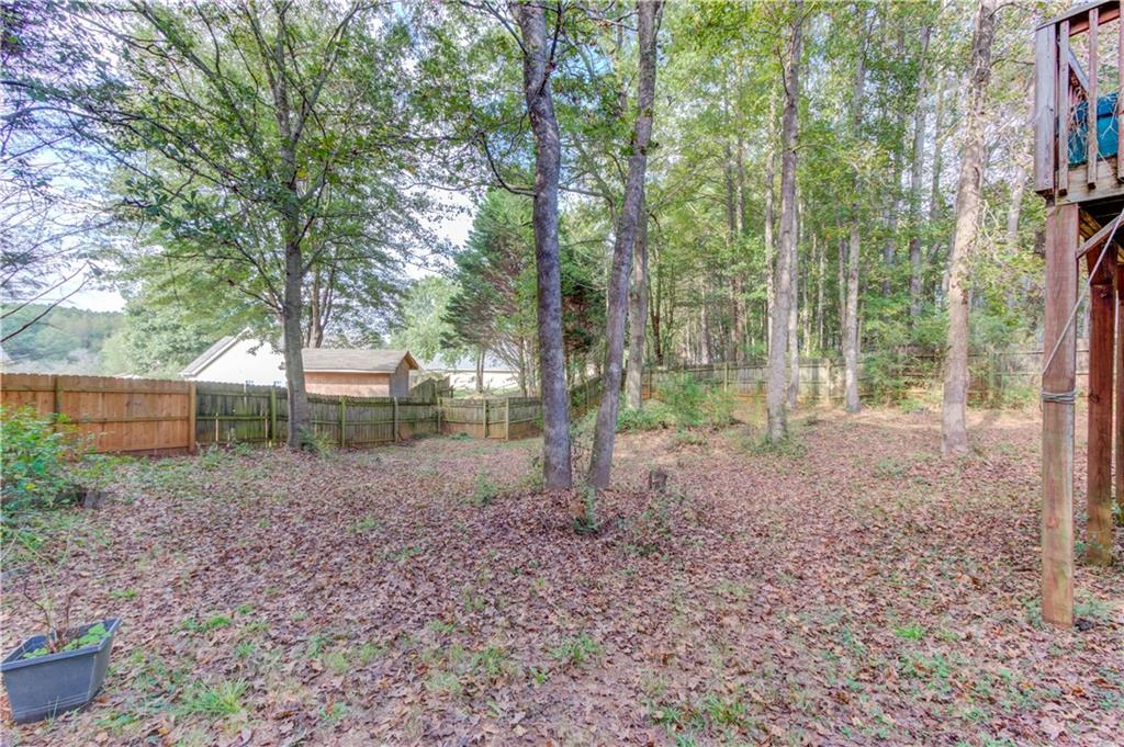 625 Springwood Trail Monroe, GA 30655 - Photo 19 of 23 a view of a yard with a tree