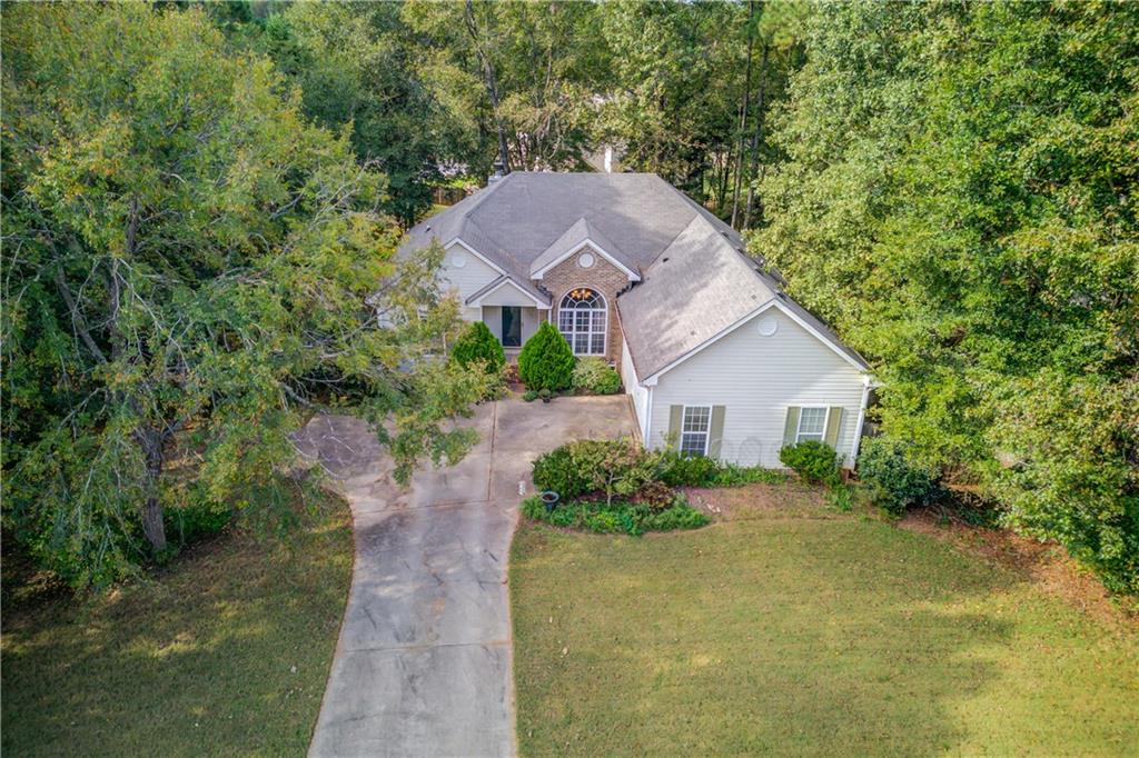 625 Springwood Trail Monroe, GA 30655 - Photo 22 of 23 a view of a house with a yard plants and large tree