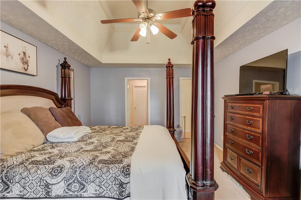 625 Springwood Trail Monroe, GA 30655 - Photo 8 of 23 a bedroom with a bed and a flat screen tv