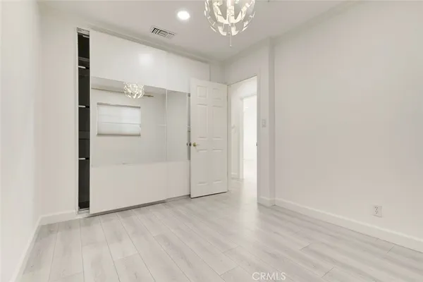 a view of a bathroom from a hallway